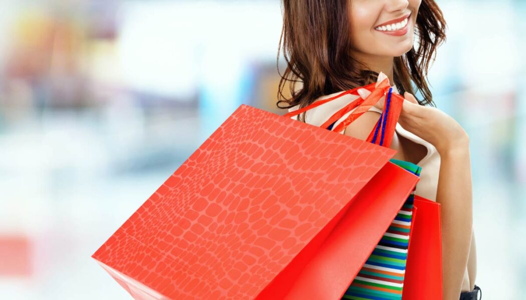 Treat Yourself: Smiling Woman With Shopping Bags
